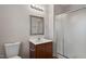 Bathroom featuring a vanity with dark wood cabinets, shower, and a framed mirror at 650 Ganyard Farm Way # 4, Durham, NC 27703
