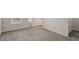 Bedroom featuring neutral carpeting, a window with blinds, and white door with adjacent closets at 650 Ganyard Farm Way # 4, Durham, NC 27703