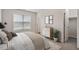 Bright bedroom with a window, a dresser with decor, and a walk-in closet at 650 Ganyard Farm Way # 4, Durham, NC 27703