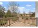 A wooden deck overlooks the backyard with mature trees and landscaping at 650 Ganyard Farm Way # 4, Durham, NC 27703