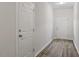 Inviting foyer featuring hardwood flooring and a conveniently located coat closet at 650 Ganyard Farm Way # 4, Durham, NC 27703