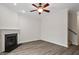 View of the living room featuring a fireplace, hardwood floors and an adjacent staircase at 650 Ganyard Farm Way # 4, Durham, NC 27703