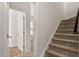 Staircase with carpeted stairs leads to the second level of the home at 650 Ganyard Farm Way # 4, Durham, NC 27703