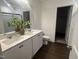 Bright bathroom with double sink vanity, quartz countertop, and a glass-enclosed shower at 6814 Galloway Dr, Middlesex, NC 27557