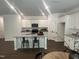 Modern kitchen with white cabinets, stainless steel appliances, and granite countertops at 6814 Galloway Dr, Middlesex, NC 27557