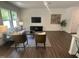 Bright living room with hardwood floors, stylish decor, and a modern TV, perfect for relaxation at 6814 Galloway Dr, Middlesex, NC 27557