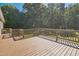 Spacious wood deck overlooks the serene, wooded backyard at 7850 Nc 42, Holly Springs, NC 27540