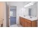 Bright bathroom with a double sink vanity and tiled floors at 7850 Nc 42, Holly Springs, NC 27540