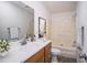 Bathroom featuring a vanity with a modern faucet, a large mirror, and a tub/shower combination at 7850 Nc 42, Holly Springs, NC 27540