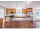 Charming kitchen featuring an island with granite countertops and stainless steel appliances at 7850 Nc 42, Holly Springs, NC 27540