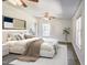 Inviting primary bedroom with a ceiling fan, plush bedding, and one window for light at 7850 Nc 42, Holly Springs, NC 27540