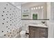 Traditional bathroom with polka-dot shower curtain, marble countertops, and decorative shelves at 811 S First St, Smithfield, NC 27577