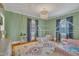 Charming bedroom with hardwood floors, decorative rug, and two ' beds at 811 S First St, Smithfield, NC 27577