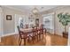 Dining room with wooden table, decorative lighting, and access to other rooms at 811 S First St, Smithfield, NC 27577