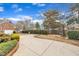 Long driveway with manicured landscaping and mature trees at 811 S First St, Smithfield, NC 27577