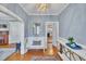 Inviting entryway featuring hardwood floors, a bench, stylish lighting, and seamless flow into other living spaces at 811 S First St, Smithfield, NC 27577