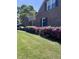 Brick house exterior with flower bushes beneath the windows and shutters at 811 S First St, Smithfield, NC 27577