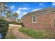 Well maintained brick home with a manicured lawn and a brick walkway at 811 S First St, Smithfield, NC 27577