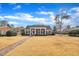 Traditional brick home with a charming front porch, offering a welcoming entrance and classic curb appeal at 811 S First St, Smithfield, NC 27577