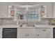 Close-up of kitchen sink with granite counters and a view through the window at 811 S First St, Smithfield, NC 27577