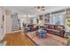 Inviting living room with hardwood floors, leather furniture, and custom built-in shelving at 811 S First St, Smithfield, NC 27577
