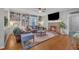 Cozy living room with stone fireplace, built-in shelves, and hardwood floors at 811 S First St, Smithfield, NC 27577