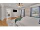 Bright main bedroom with ensuite bathroom, hardwood floors, and stylish decor at 811 S First St, Smithfield, NC 27577