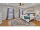 Spacious main bedroom with hardwood floors, king bed, and stylish decor at 811 S First St, Smithfield, NC 27577