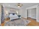 Comfortable main bedroom with hardwood floors, stylish decor, and king sized bed at 811 S First St, Smithfield, NC 27577