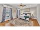 Bright main bedroom with hardwood floors, king bed, and custom window treatments at 811 S First St, Smithfield, NC 27577