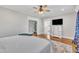 Large main bedroom with hardwood floors, television, and ensuite bathroom access at 811 S First St, Smithfield, NC 27577
