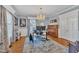 Stylish home office featuring a chandelier, a piano, and large window at 811 S First St, Smithfield, NC 27577