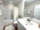 Bathroom featuring a sink, vanity, toilet and shower with a tub combination at 897 W Main St, Benson, NC 27504