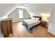 Bright bedroom features hardwood floors, a cozy bed, and ample natural light from the window at 897 W Main St, Benson, NC 27504
