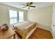 This bedroom has two windows that provides plenty of natural light and a ceiling fan for added comfort at 897 W Main St, Benson, NC 27504