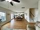 Open-concept floor plan with a dining area, staircase, and views of the kitchen and backyard at 897 W Main St, Benson, NC 27504
