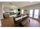 Spacious living area with a fireplace, dining table, and access to the backyard, creating a comfortable atmosphere at 897 W Main St, Benson, NC 27504