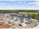 Aerial view of a new townhouse community with colorful exteriors at 92 Ripple Way # 315, Clayton, NC 27520