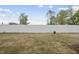Backyard with a privacy fence and grass at 92 Ripple Way # 315, Clayton, NC 27520