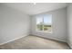 Bedroom with large window providing natural light and landscape view at 92 Ripple Way # 315, Clayton, NC 27520