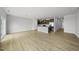Spacious living room showcasing modern kitchen, island, and open-concept design with bright, natural light at 92 Ripple Way # 315, Clayton, NC 27520