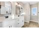 Elegant bathroom with double vanities, granite countertops, and a walk-in shower at 9246 Otter Ct, Middlesex, NC 27557