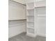 Spacious walk-in closet with custom shelving, providing ample storage space for your wardrobe at 9246 Otter Ct, Middlesex, NC 27557