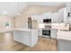 Modern kitchen with stainless steel appliances, granite countertops, and a center island at 9246 Otter Ct, Middlesex, NC 27557