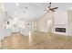 Bright and airy living room featuring high ceilings, a modern fireplace, and hardwood floors at 9246 Otter Ct, Middlesex, NC 27557