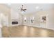 Cozy living room with a stylish fireplace, ceiling fan and a view of the backyard at 9246 Otter Ct, Middlesex, NC 27557