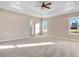 Luxurious main bedroom featuring plush carpeting, ample natural light, and a spacious layout at 9246 Otter Ct, Middlesex, NC 27557