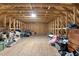 Spacious unfinished attic featuring wood beam construction offers potential for future expansion and flexible storage solutions at 955 Lynch Rd, Selma, NC 27576
