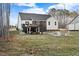 Well manicured lawn, covered porch, and gazebo with firepit provides the perfect spot for entertaining at 955 Lynch Rd, Selma, NC 27576