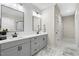 Modern bathroom with dual vanities, stylish mirrors, and updated fixtures offers a sleek and functional space at 955 Lynch Rd, Selma, NC 27576